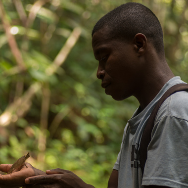 WCS local man holding chameleon in Madagascar